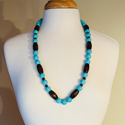 EXEX sterling silver and turquoise necklace with wood beads displayed on mannequin bust