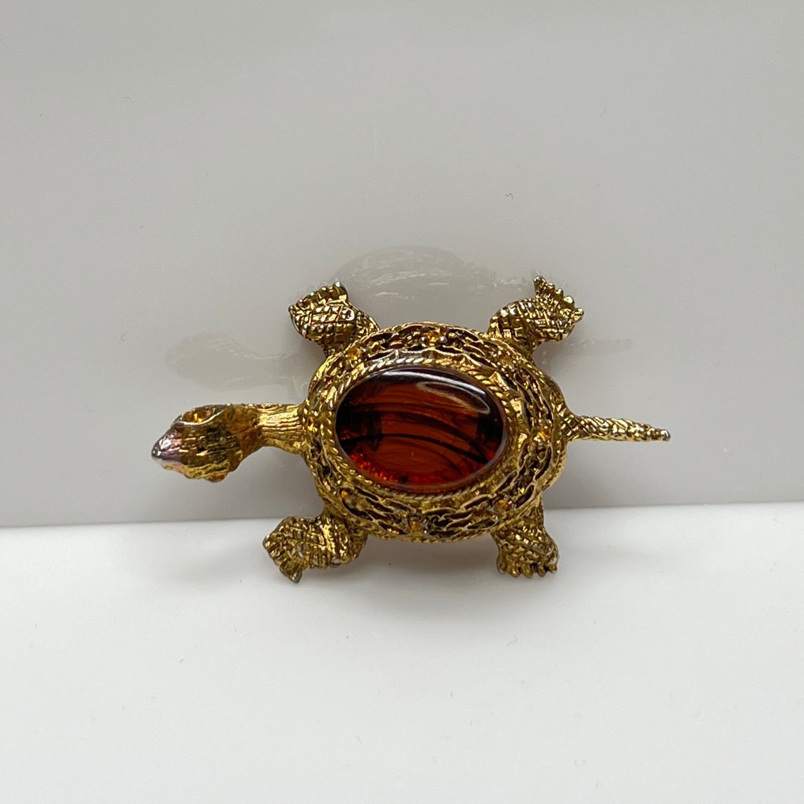 Vintage figural turtle brooch with glass tortoise shell top and filigree gold body