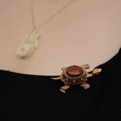 Vintage figural turtle brooch with glass tortoise shell top and filigree gold body