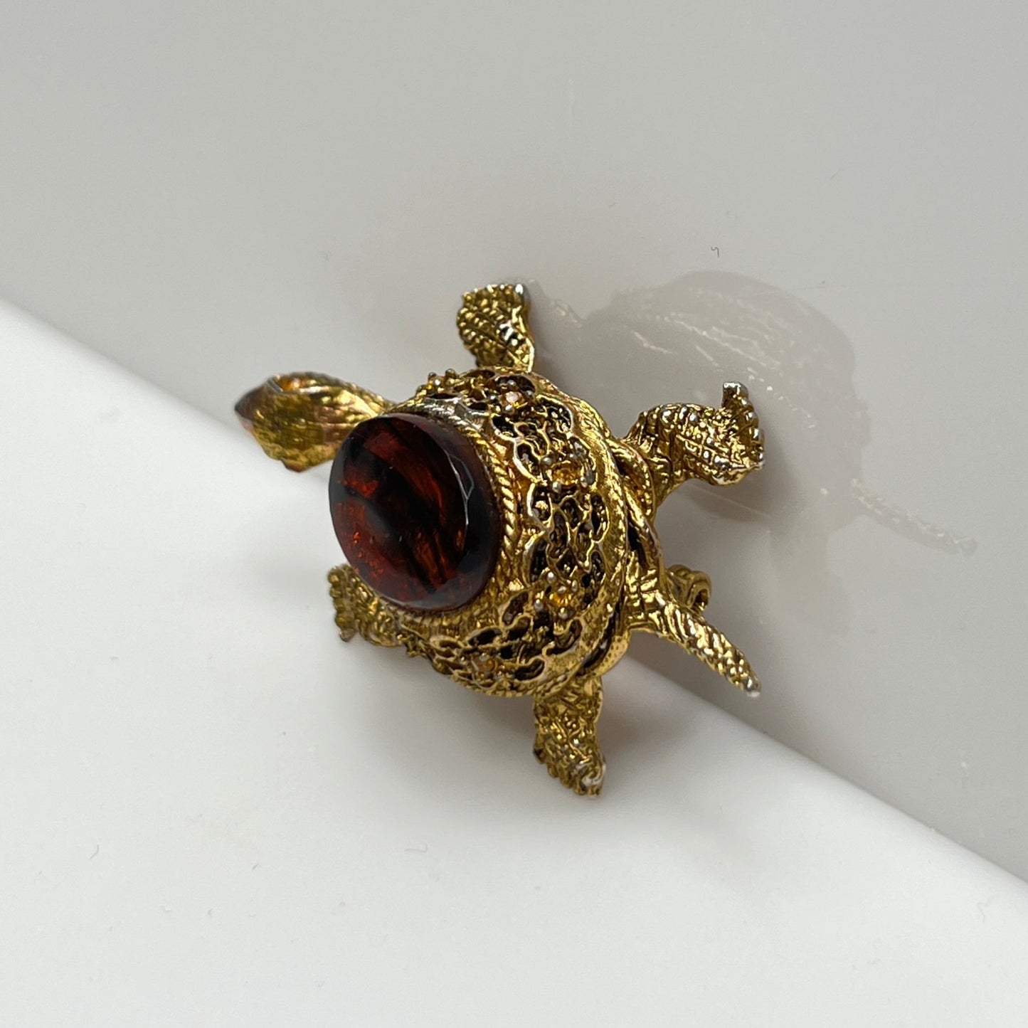 Vintage figural turtle brooch with glass tortoise shell top and filigree gold body