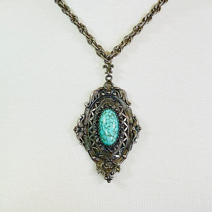 Ornate Victorian Revival pendant with oval faux turquoise cabochon