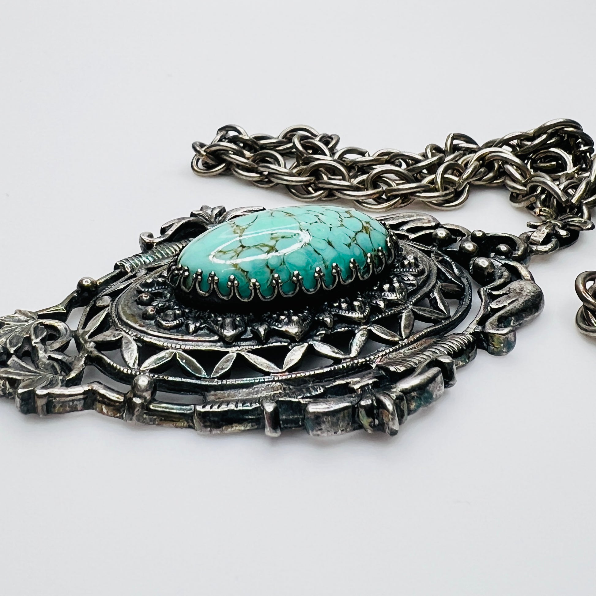 Ornate Victorian Revival pendant with oval faux turquoise cabochon