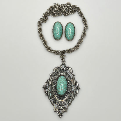 Vintage silver-tone necklace with large faux turquoise pendant and matching earrings