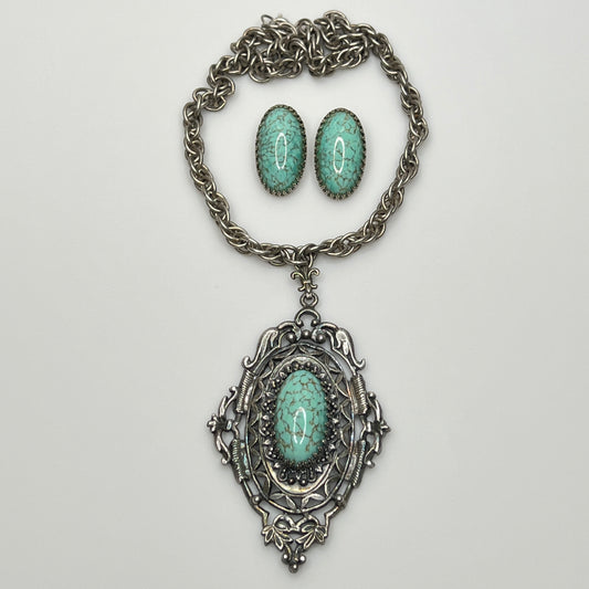 Vintage silver-tone necklace with large faux turquoise pendant and matching earrings