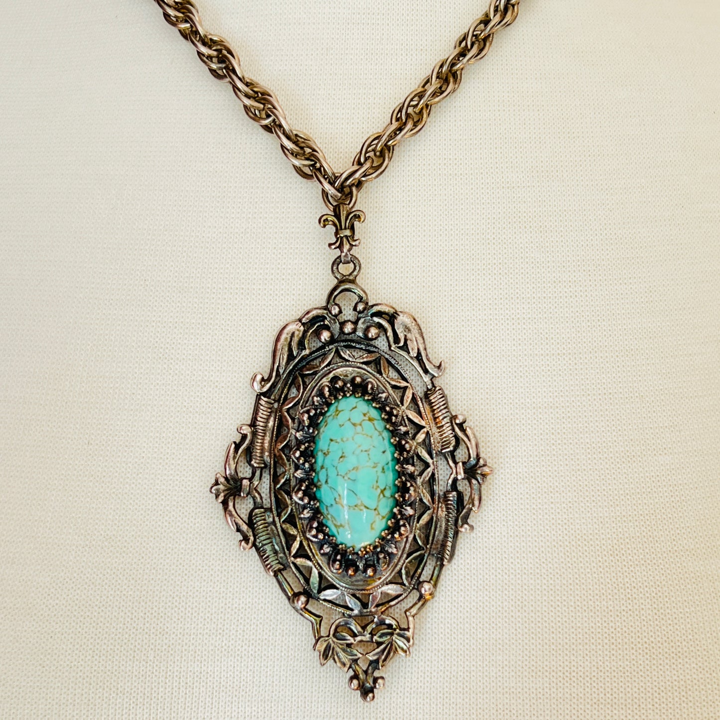 Ornate Victorian Revival pendant with oval faux turquoise cabochon