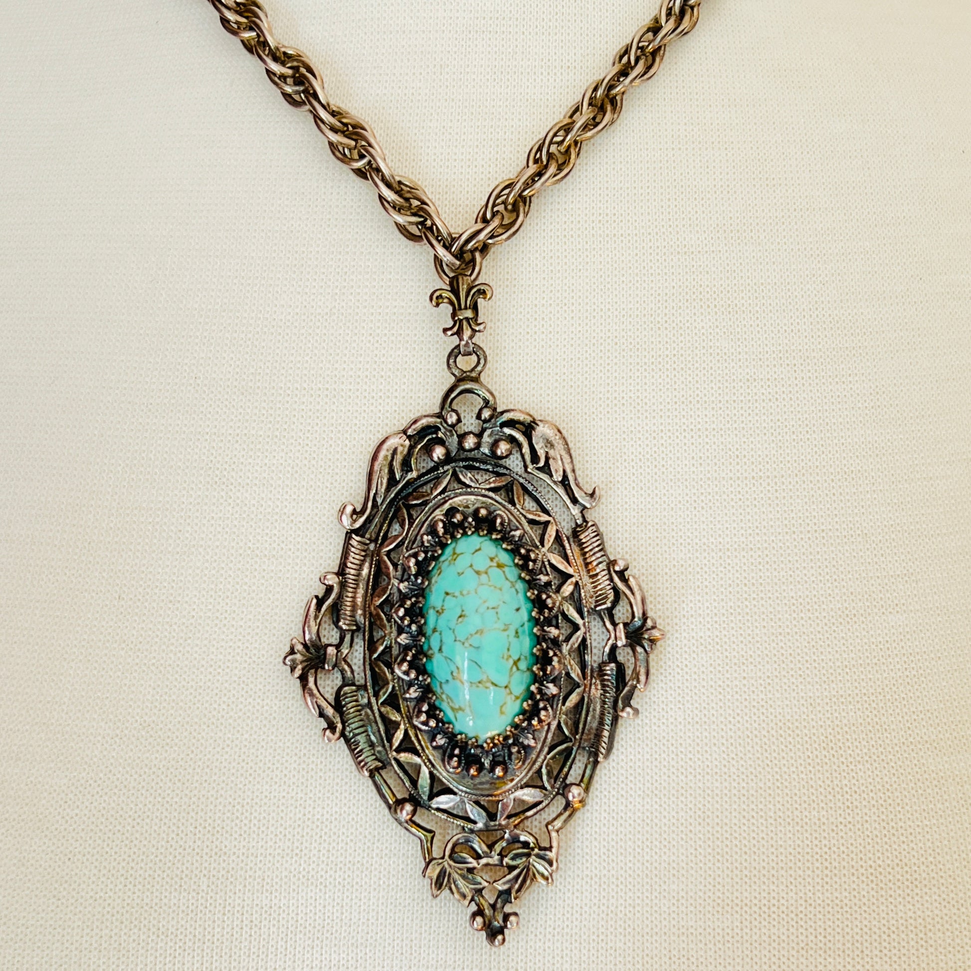Ornate Victorian Revival pendant with oval faux turquoise cabochon