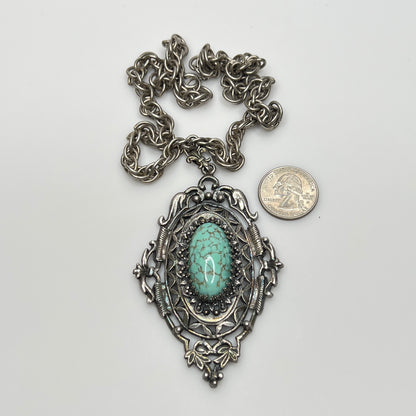 Ornate Victorian Revival pendant with oval faux turquoise cabochon