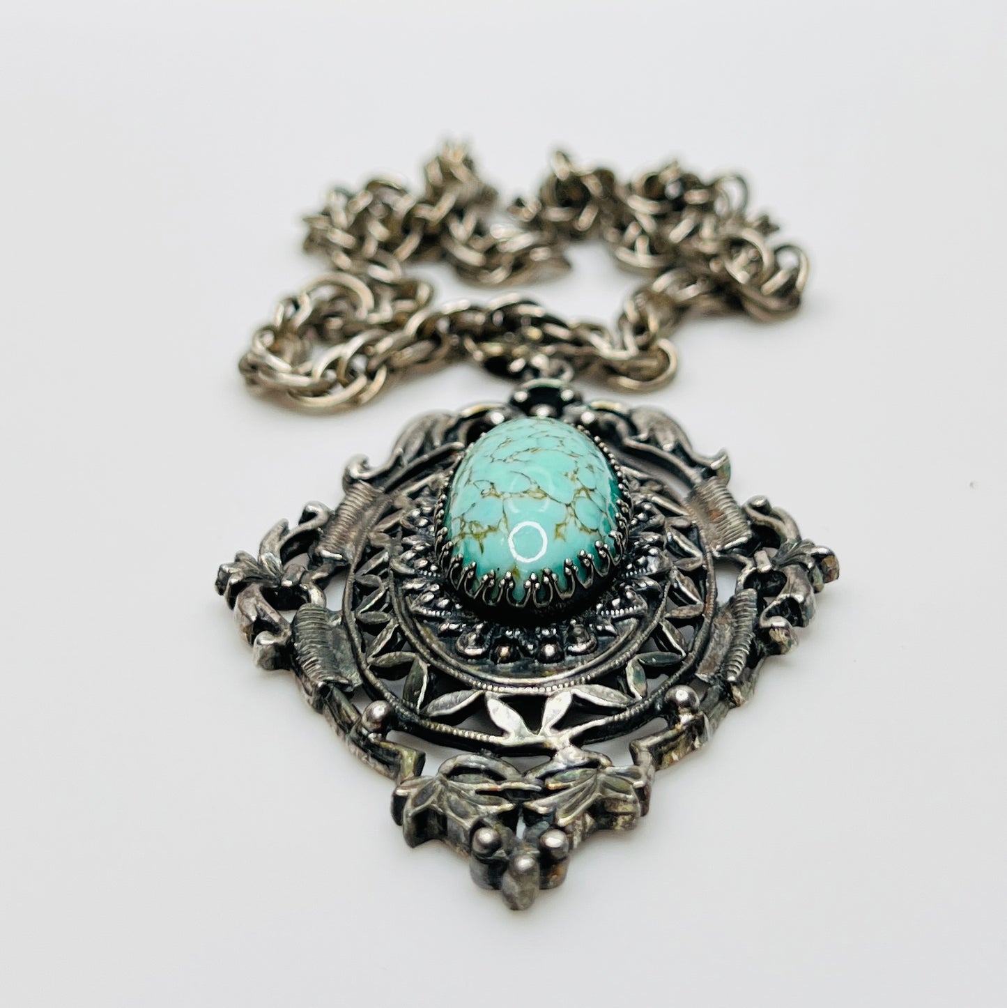 Ornate Victorian Revival pendant with oval faux turquoise cabochon