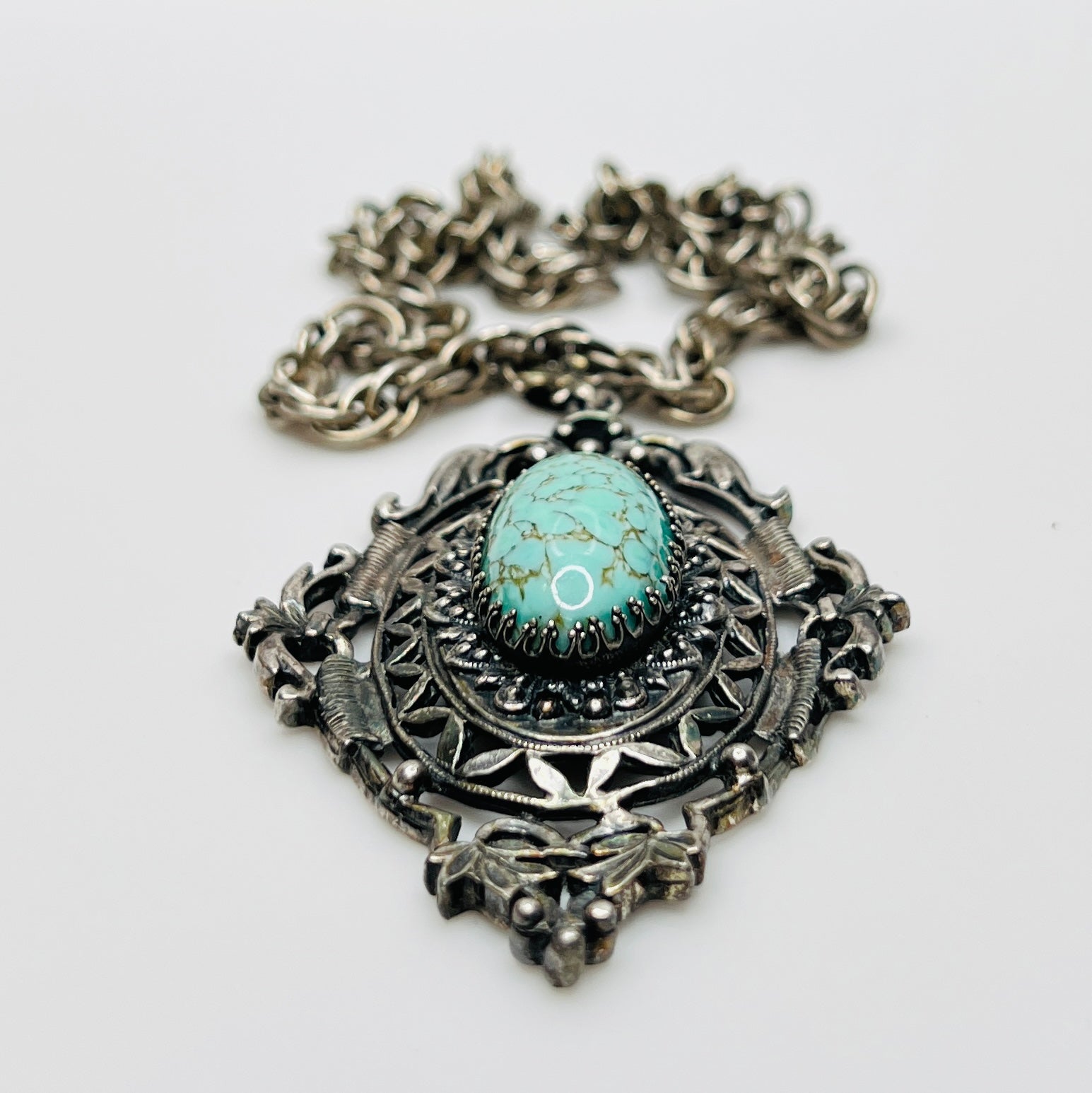 Ornate Victorian Revival pendant with oval faux turquoise cabochon
