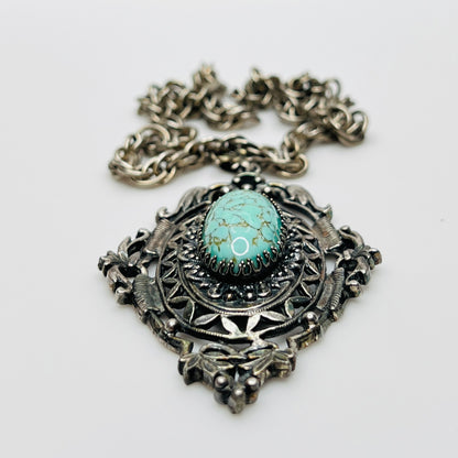 Ornate Victorian Revival pendant with oval faux turquoise cabochon