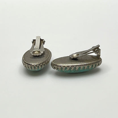 Clip-on earrings with crackled turquoise-style cabochons in silver setting