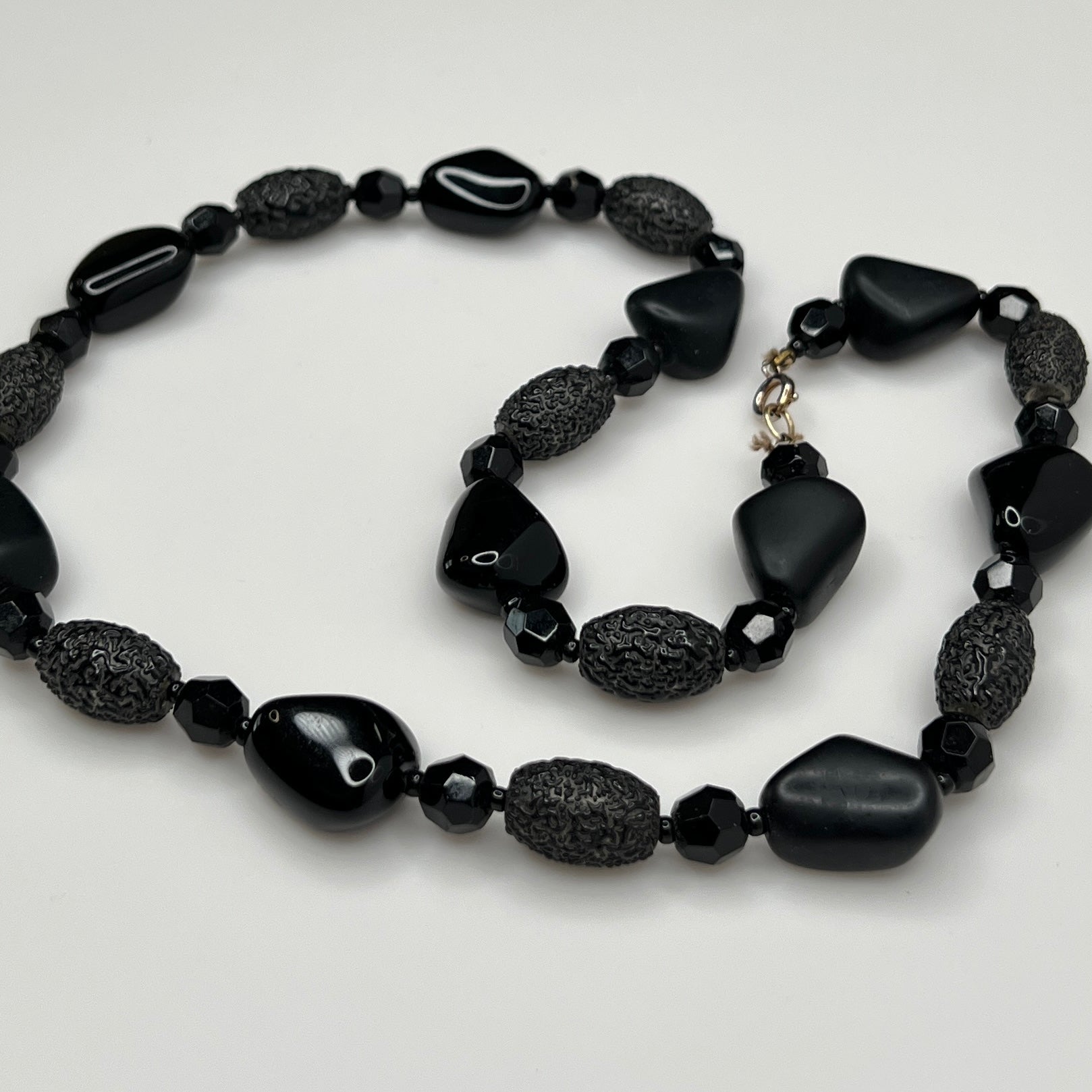 1980s black bead necklace coiled flat, 24 inches long