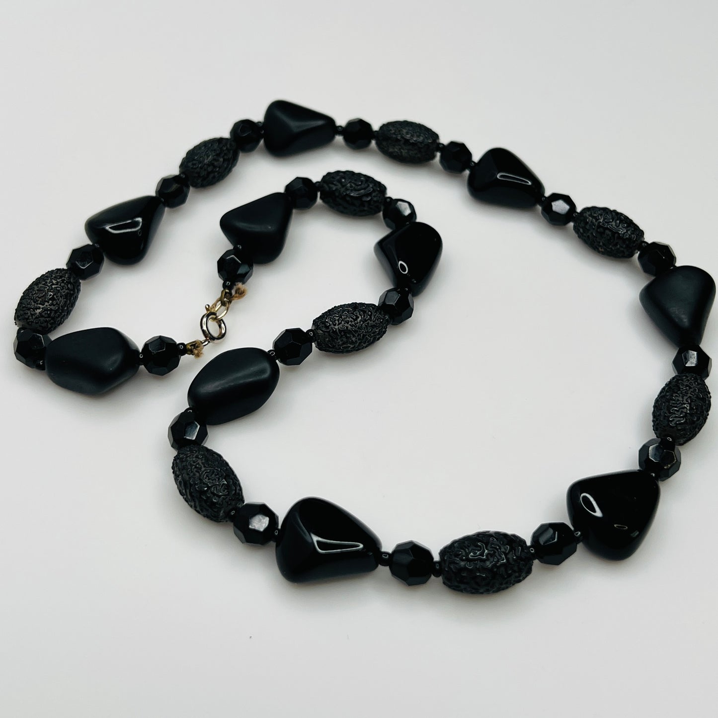 1980s black bead necklace coiled flat, 24 inches long