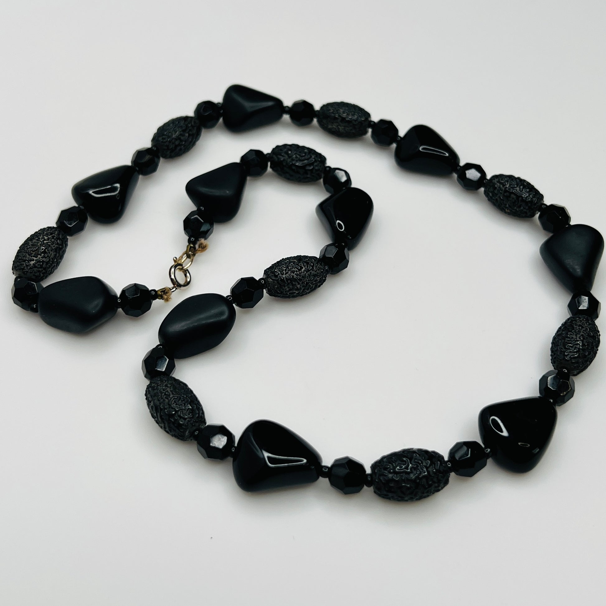 1980s black bead necklace coiled flat, 24 inches long