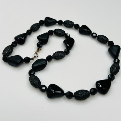 1980s black bead necklace coiled flat, 24 inches long