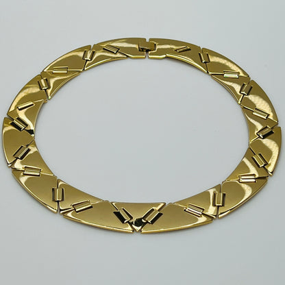 Gold geometric statement necklace with architectural flair