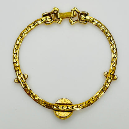 Full back view of gold-tone bracelet with fold-over clasp