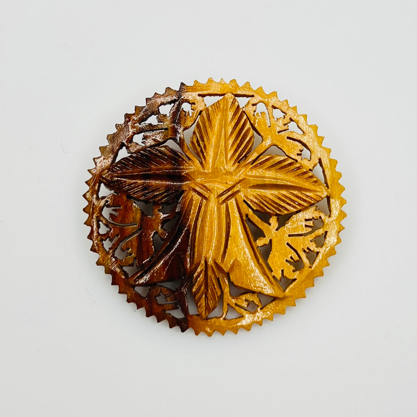 Hand carved olive wood floral brooch with pierced border