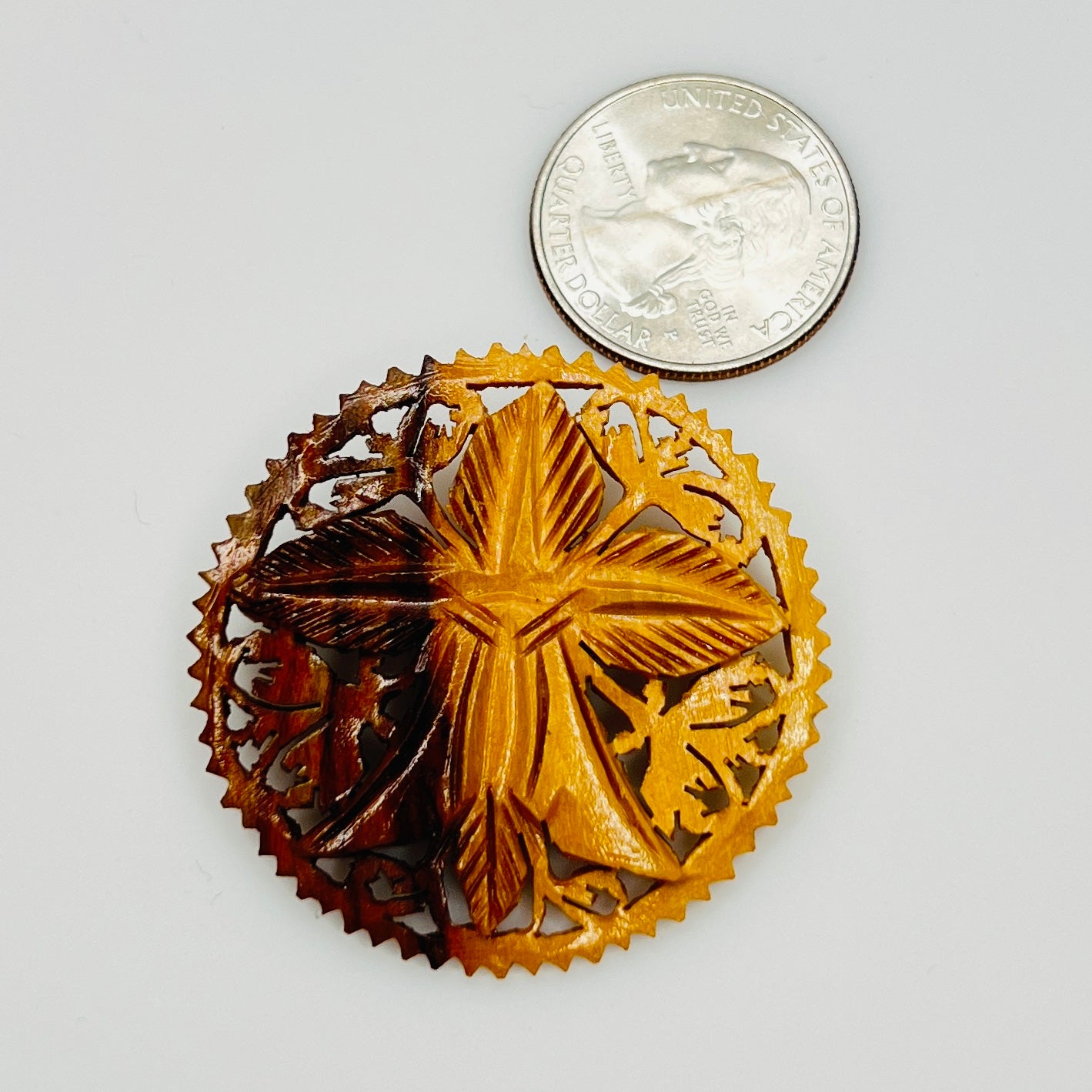 Hand carved olive wood floral brooch with pierced border