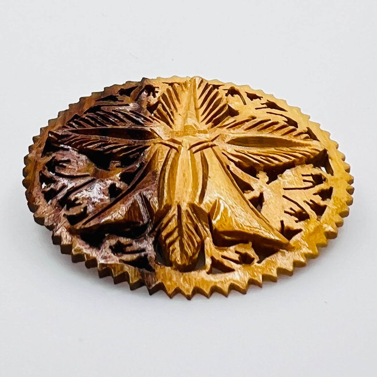 Hand carved olive wood floral brooch with pierced border