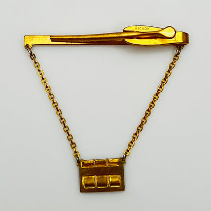 Back view of midcentury monogram tie clip in gold-tone brass