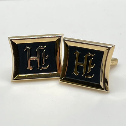 Rectangular gold cufflinks with black enamel and Gothic letter H
