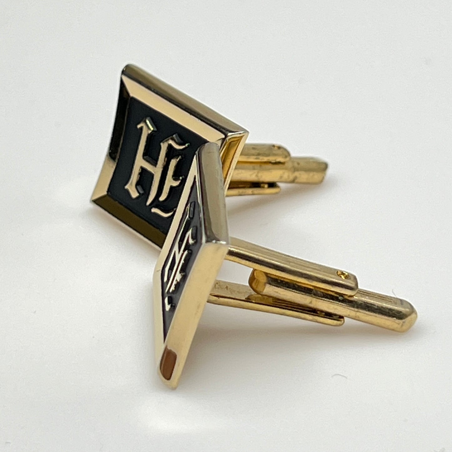 Vintage Hickok gold-tone cufflinks with black enamel and H monogram