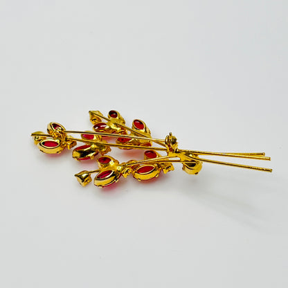 Close-up of unsigned Juliana brooch with prong-set glass rhinestones and layered structure