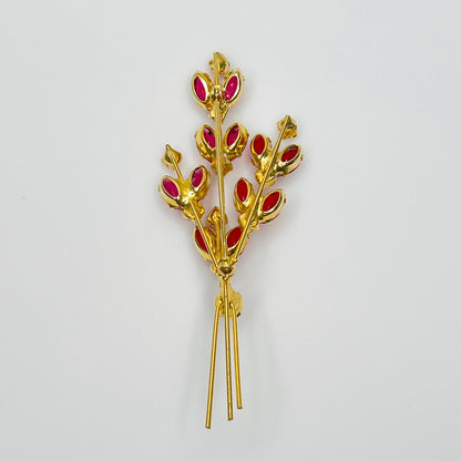 Close-up of unsigned Juliana brooch with prong-set glass rhinestones and layered structure