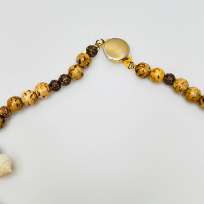 Vintage Karen Reed shell necklace with gold-tone Bergere clam and conch charms