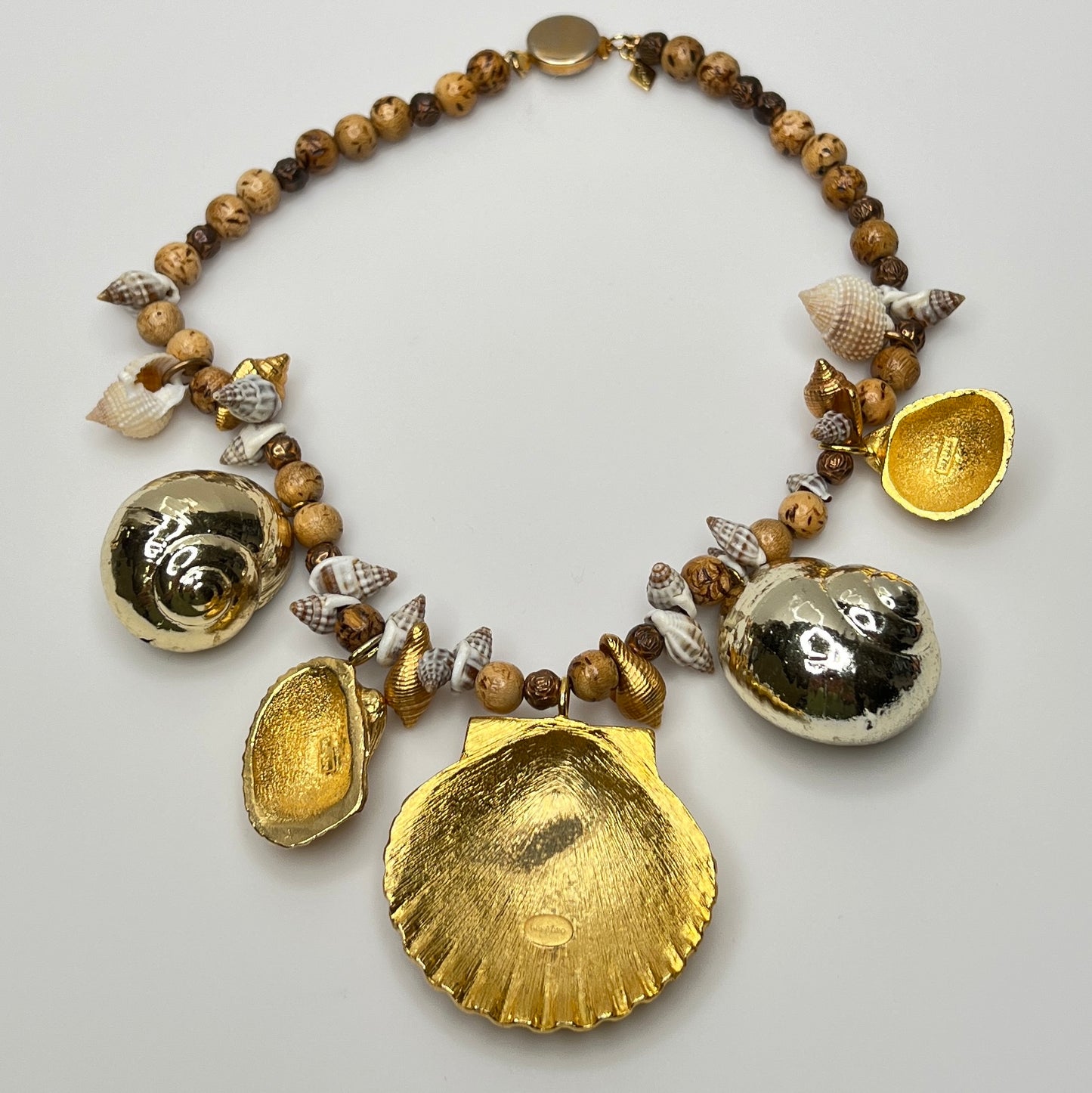 Vintage Karen Reed shell necklace with gold-tone Bergere clam and conch charms