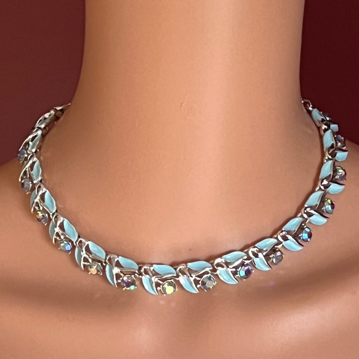 Blue enamel and rhinestone choker necklace modeled on neck