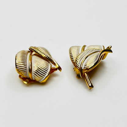 Side view vintage Kramer gold tone enamel leaf clip earrings