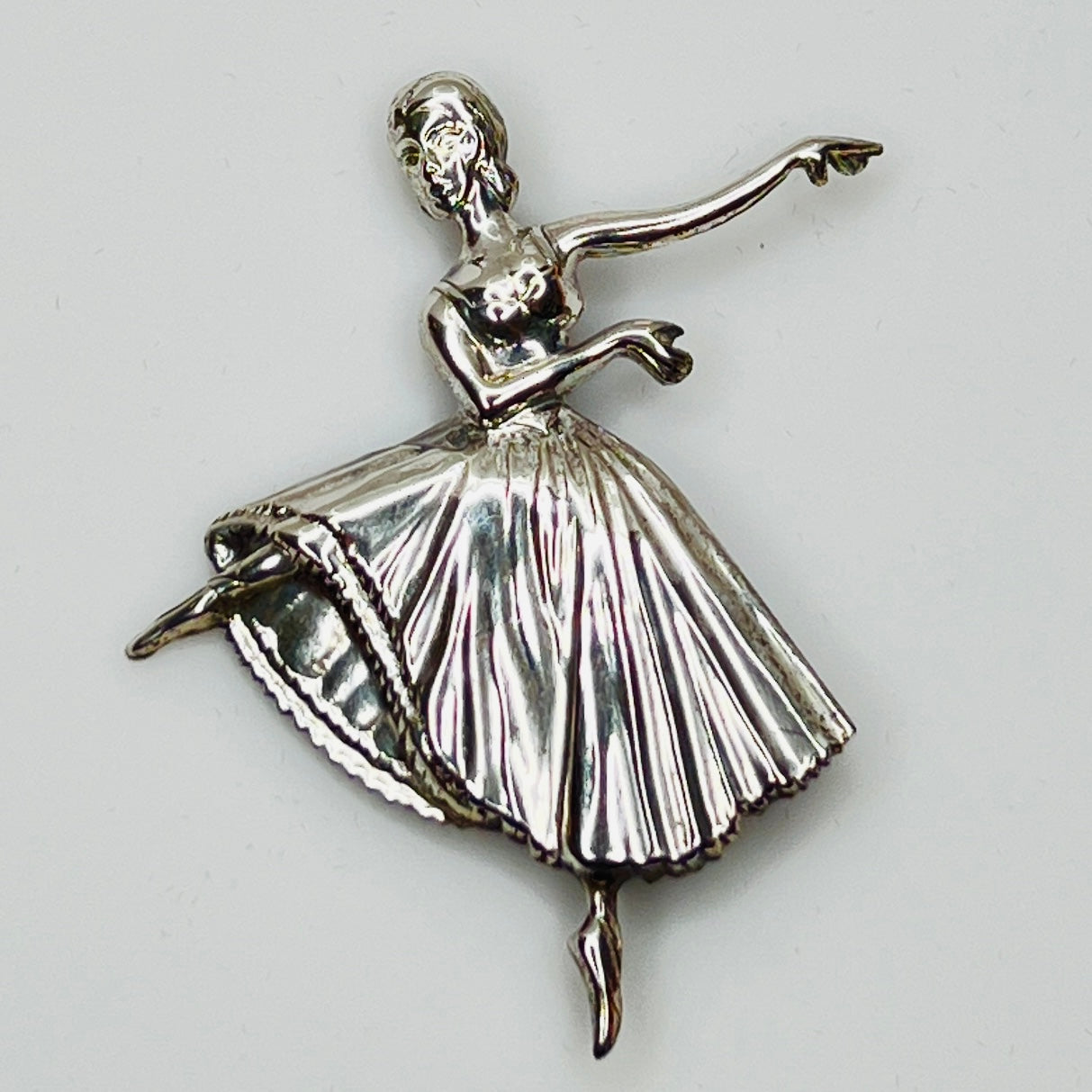 Sterling silver ballerina brooch with pleated skirt and outstretched arms