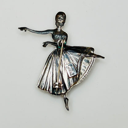 Back view showing “STERLING Lang” maker’s mark and pin clasp