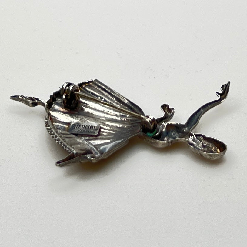 Back view showing “STERLING Lang” maker’s mark and pin clasp