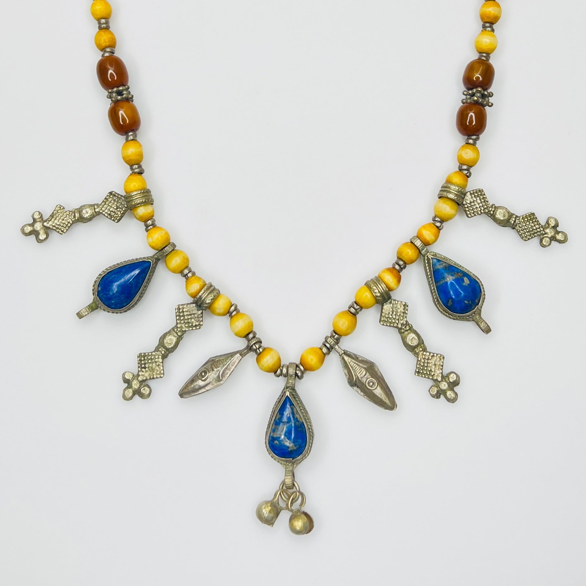 Vintage tribal necklace with lapis lazuli teardrop charms and yellow beads