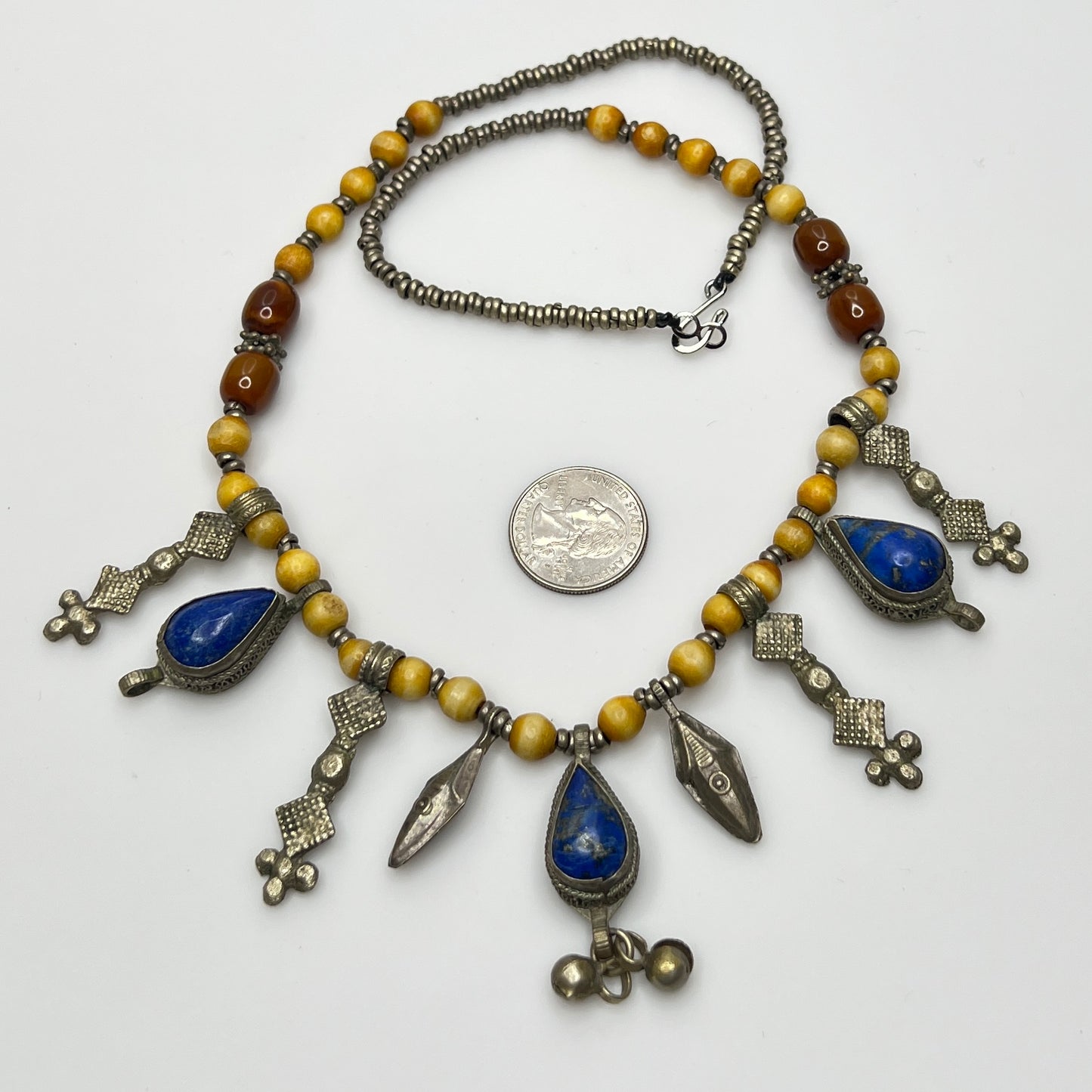 Artisan beaded necklace with silver tribal dangles and blue stones