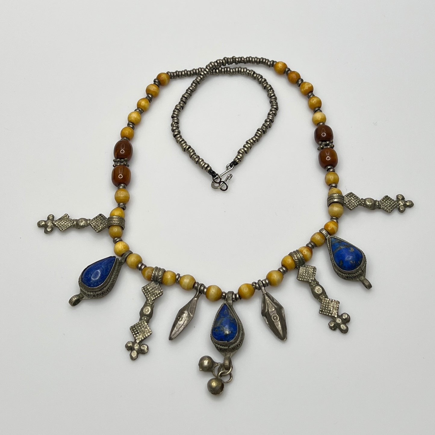 Artisan beaded necklace with silver tribal dangles and blue stones