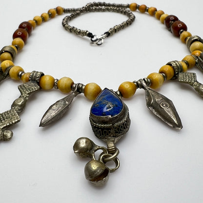 Close-up of lapis lazuli charms and mixed metal detailing