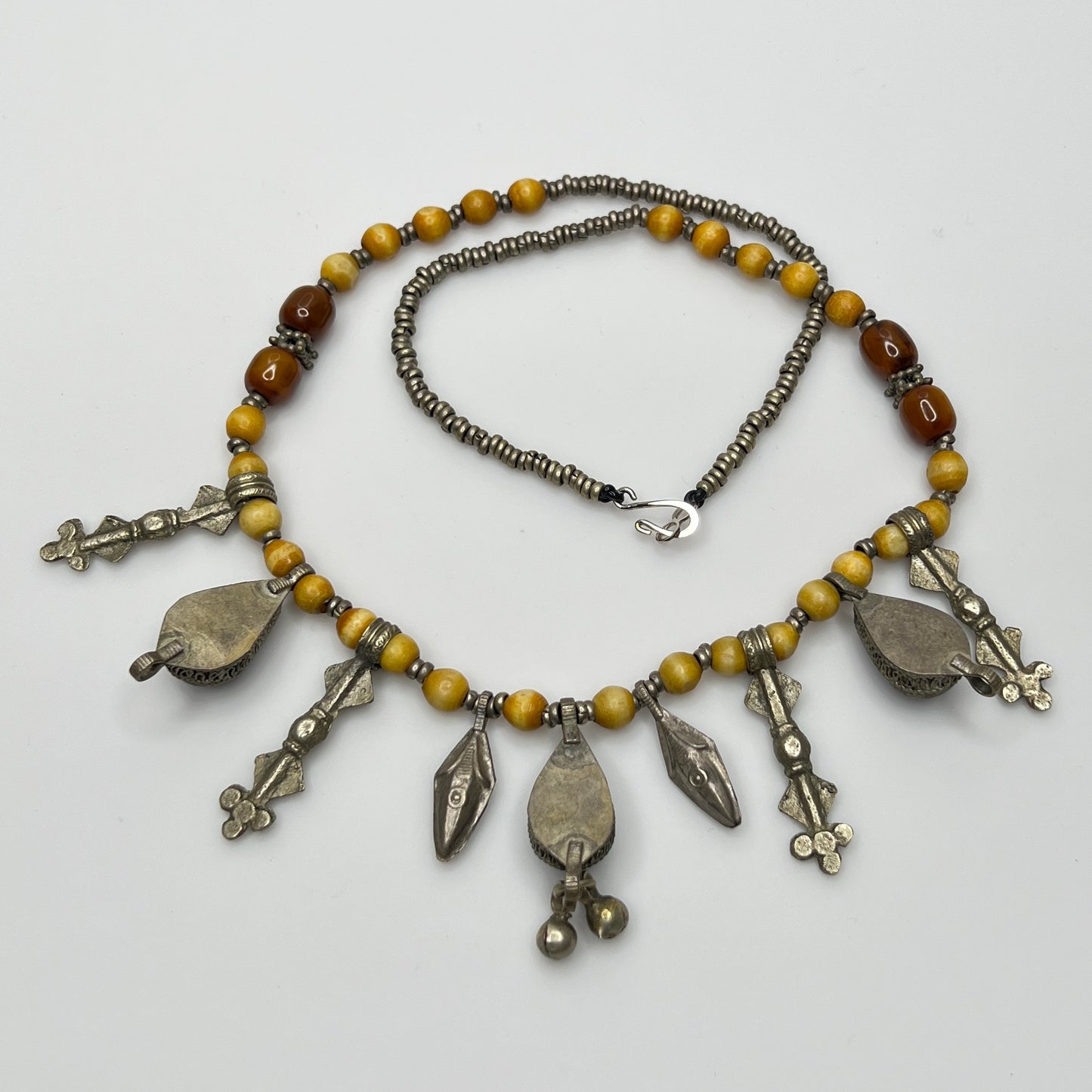 Close-up of lapis lazuli charms and mixed metal detailing