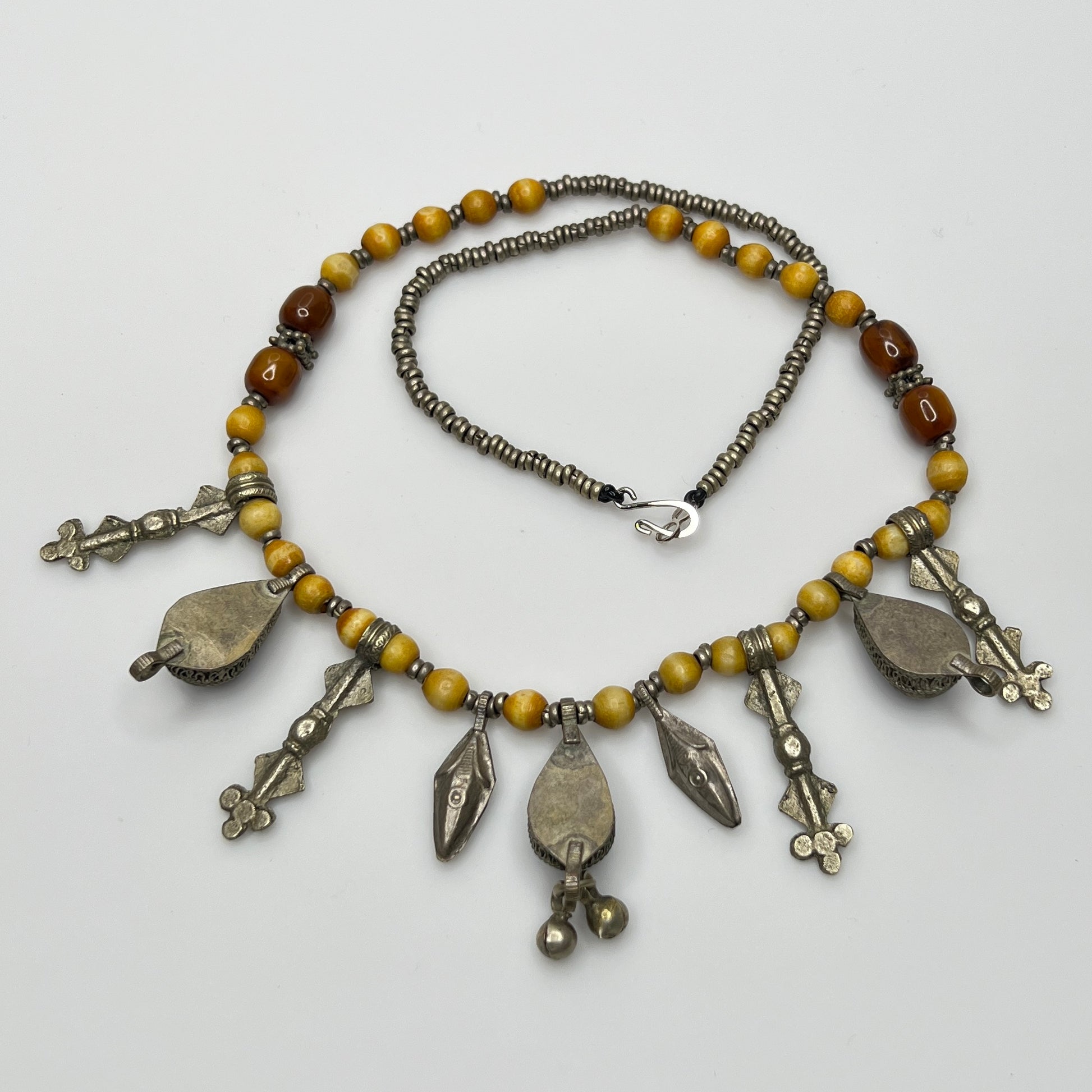 Close-up of lapis lazuli charms and mixed metal detailing