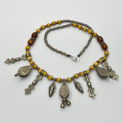 Close-up of lapis lazuli charms and mixed metal detailing