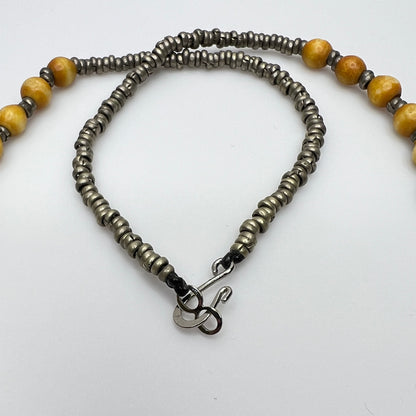 Close-up of lapis lazuli charms and mixed metal detailing