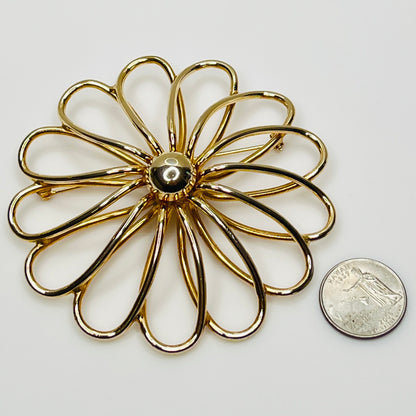 Extra large gold-tone daisy brooch with openwork petals