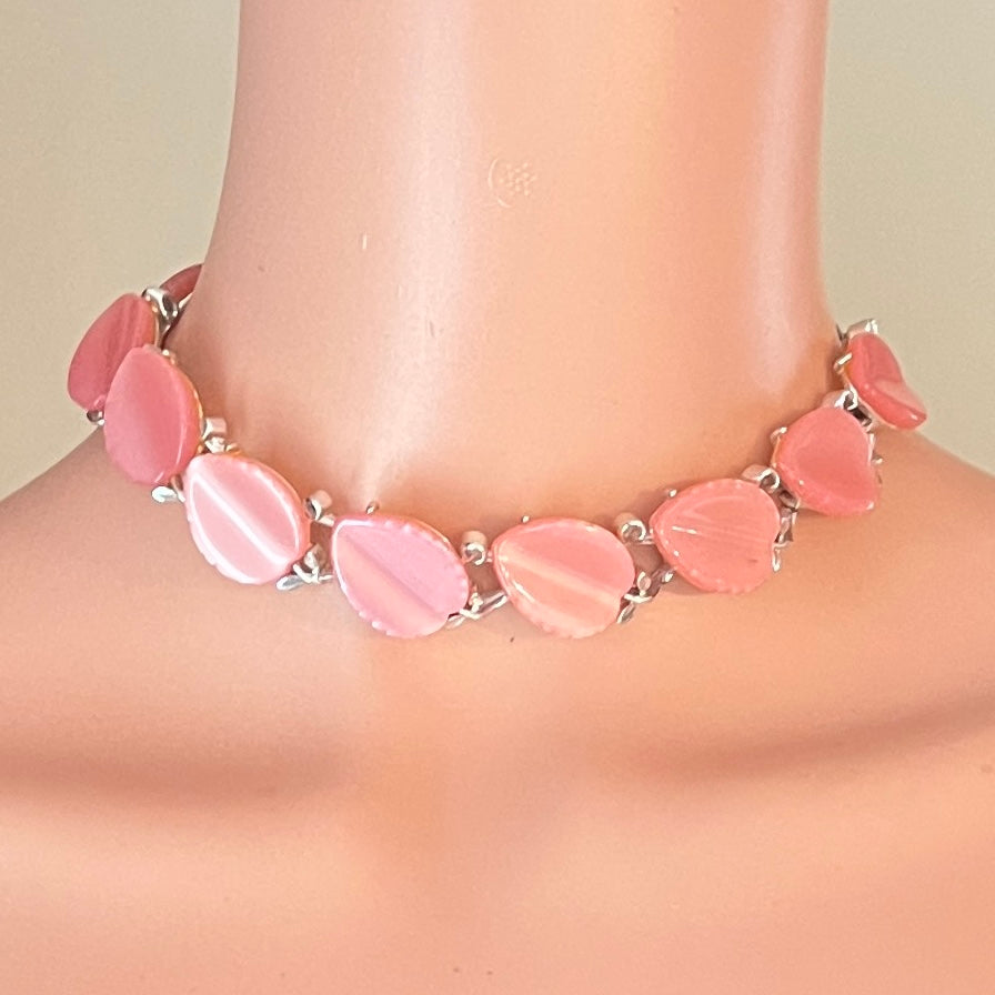 1950s Lisner pink lucite leaf necklace shown on mannequin