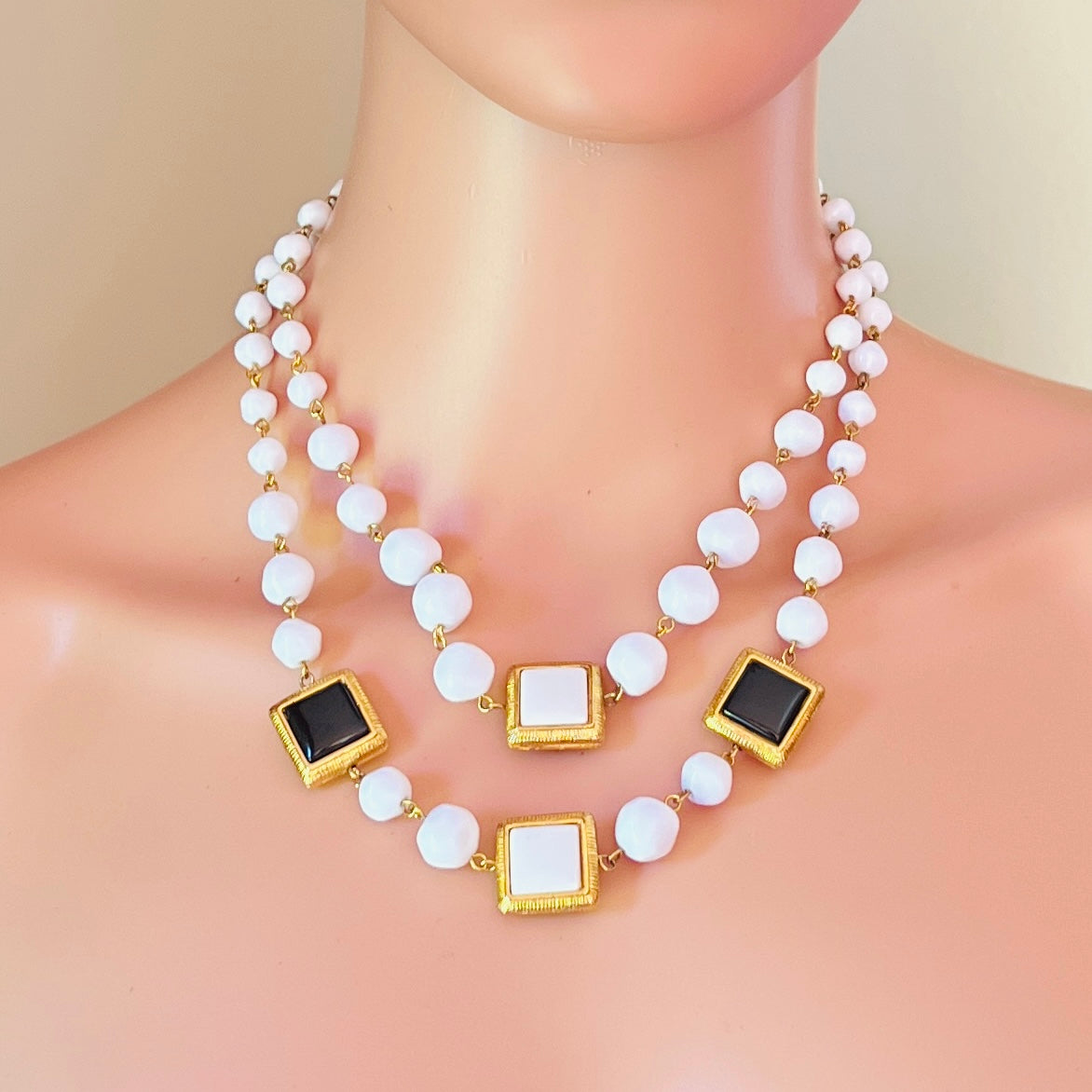Liz Claiborne reversible black white necklace worn on mannequin