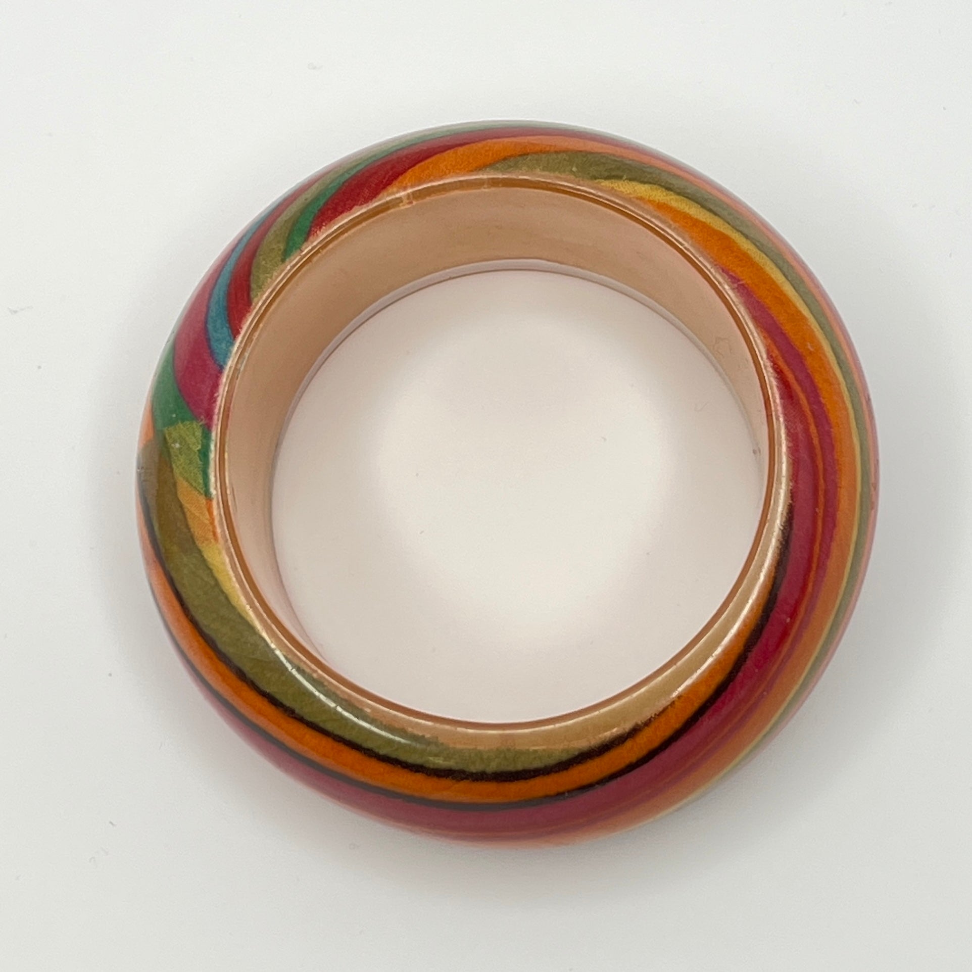 Wide retro lucite bangle bracelet with rainbow earth-tone stripes
