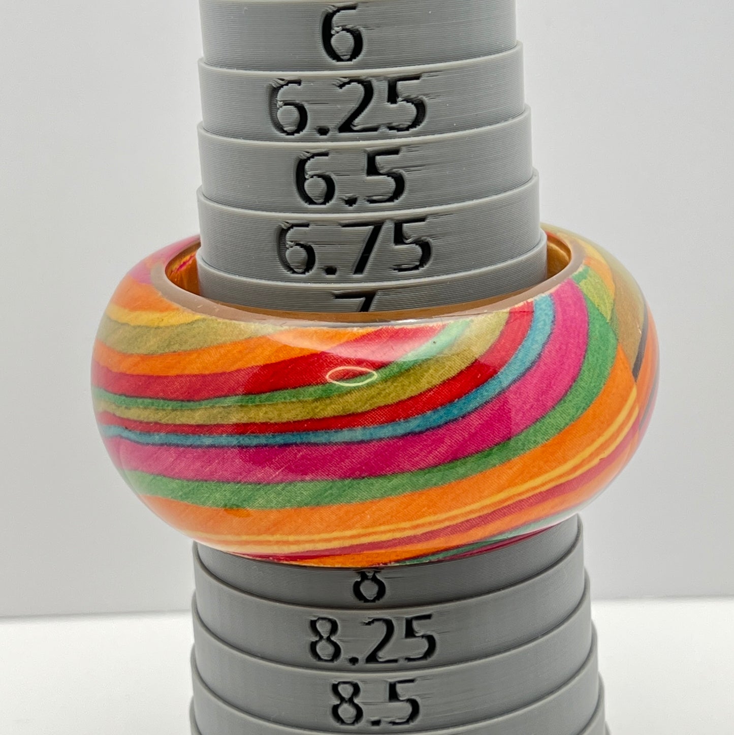 Wide retro lucite bangle bracelet with rainbow earth-tone stripes