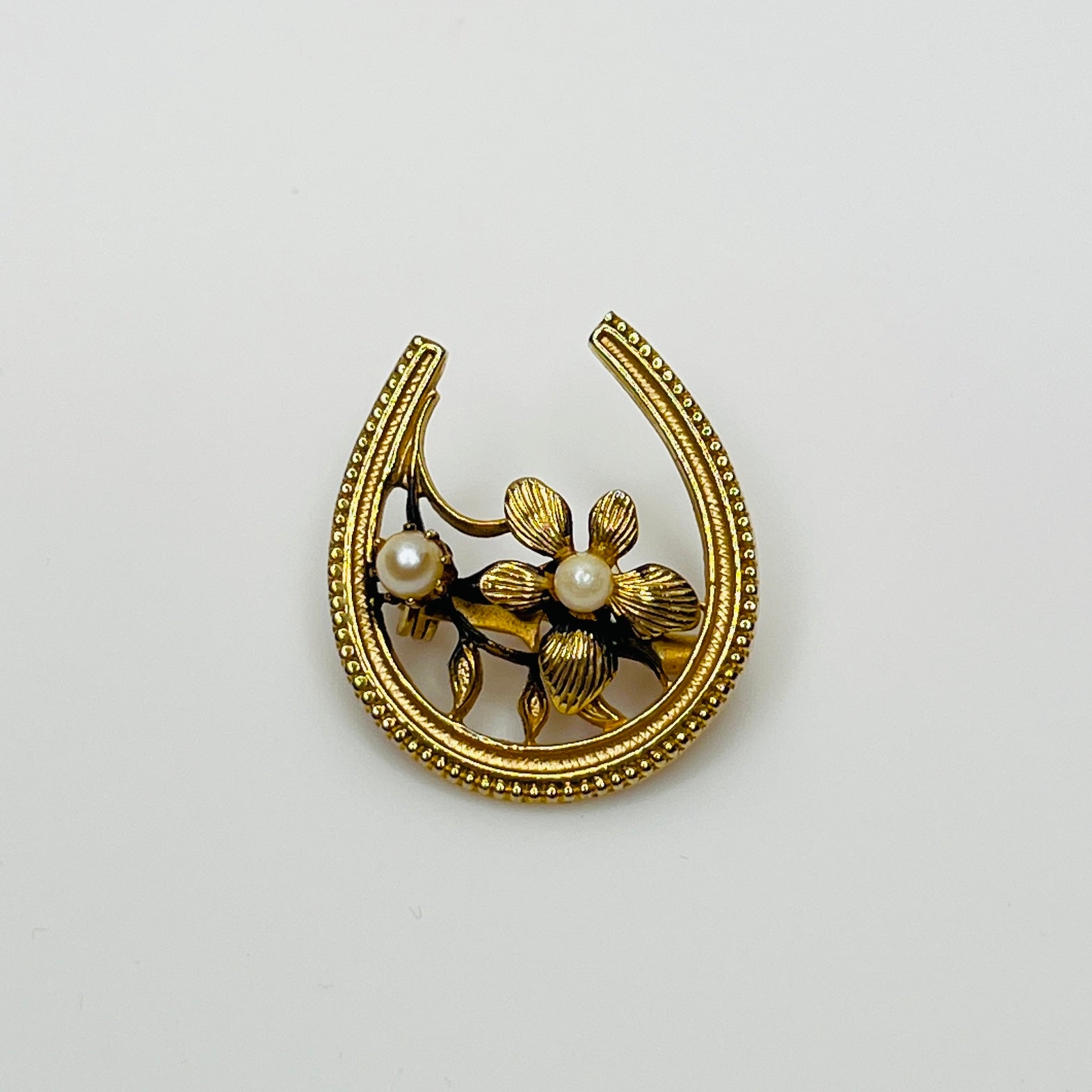 Lucky horseshoe pin with textured flower and genuine pearls